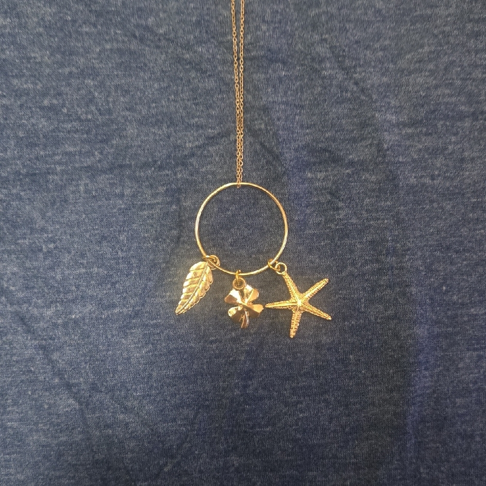 Elegant Gold Necklace with Leaf, Flower, and Starfish Charms
